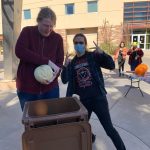 Mari Todd & Aidan Winblad cleaning while cutting
